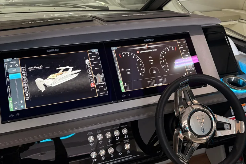  Yacht Photos Pics Dashboard of 2025 Searay 400 SLX boat with dual Simrad displays and steering wheel.