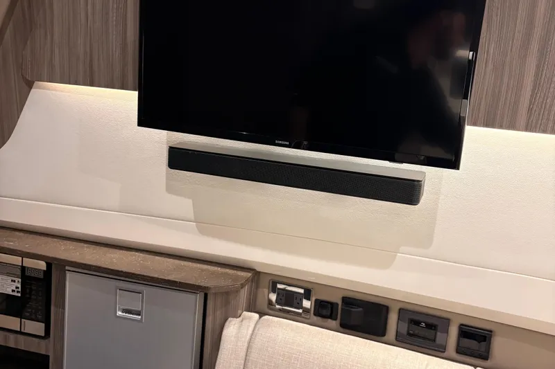  Yacht Photos Pics Interior of 2025 Searay 400 SLX with mounted TV and soundbar.