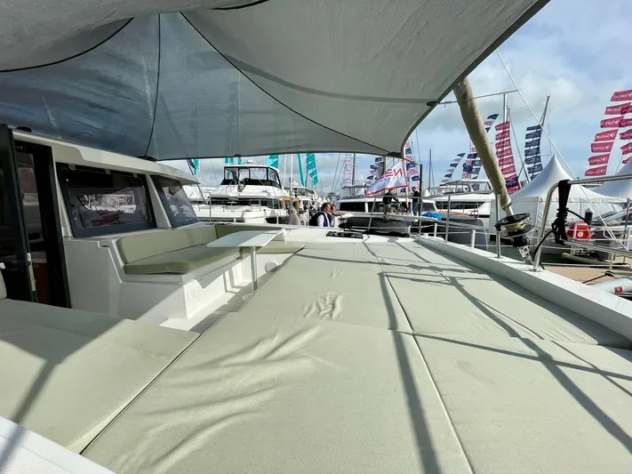 Bali 4.2 Yacht Photos Pics Modern Bali 4.2 catamaran deck with seating, 2026 model, at a boat show.