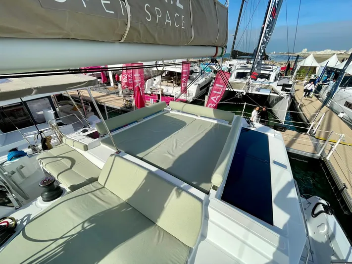 Bali 4.2 Yacht Photos Pics Modern Bali 4.2 catamaran deck, 2026 model, docked at marina with sunbathing area.