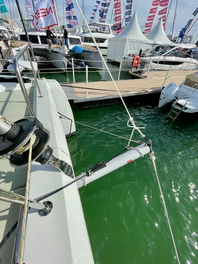 Bali 4.2 Yacht Photos Pics Bali 4.2 yacht docked at marina with flags and tents, 2026 model.