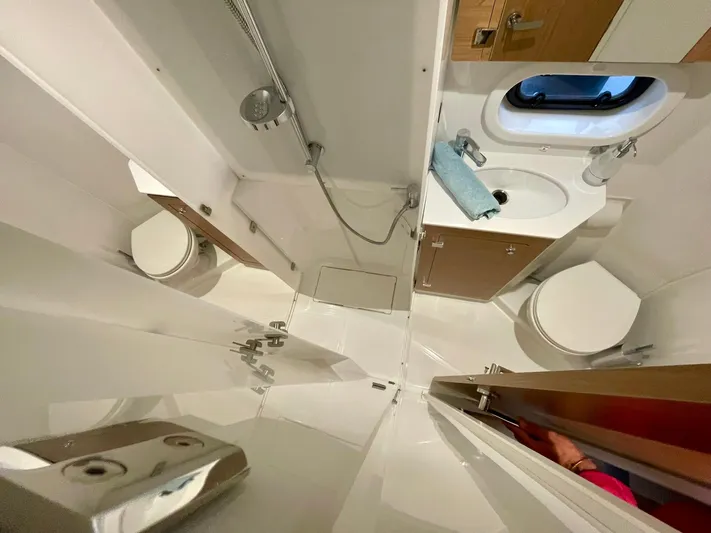 Bali 4.2 Yacht Photos Pics Compact bathroom in 2026 Bali 4.2 model, featuring shower, sink, and toilet.