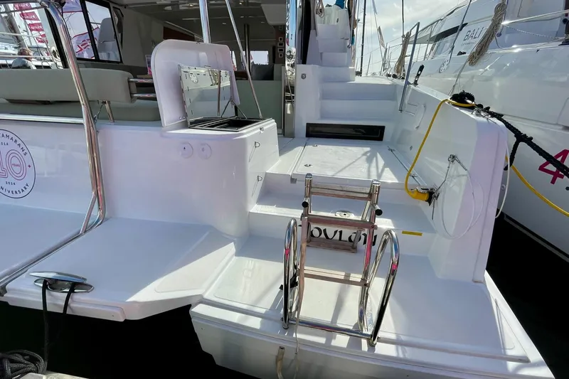 Bali 4.2 Yacht Photos Pics Sleek Bali 4.2 yacht deck with modern design, featuring steps and railing, 2026 model.