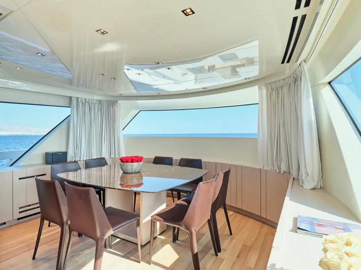 M/y America Yacht Photos Pics Luxurious dining area on 2022 Sanlorenzo SX76 yacht with ocean view.