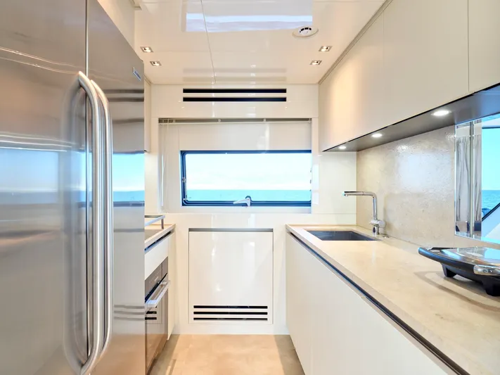 M/y America Yacht Photos Pics Modern kitchen interior on 2022 Sanlorenzo SX76 yacht, featuring sleek design and stainless steel appliances.