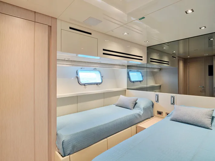 M/y America Yacht Photos Pics Luxurious Sanlorenzo SX76 2022 yacht cabin with twin beds and modern interior design.