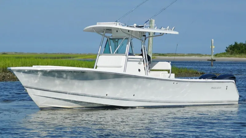  Yacht Photos Pics 2006 Regulator 32 FS boat on calm water, clear sky background.