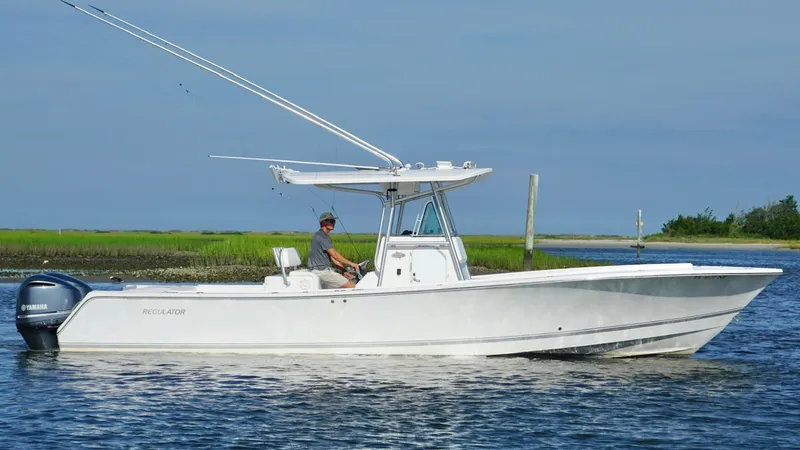  Yacht Photos Pics 2006 Regulator 32 FS boat on calm water with Yamaha engines.