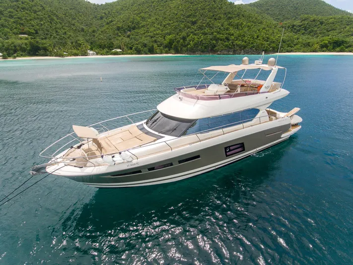  Yacht Photos Pics Luxury 2013 Prestige 620 yacht anchored in scenic tropical waters.