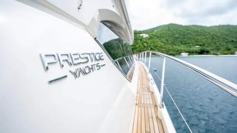  Yacht Photos Pics Luxury Prestige 620 yacht cruising on serene waters, 2013 model.