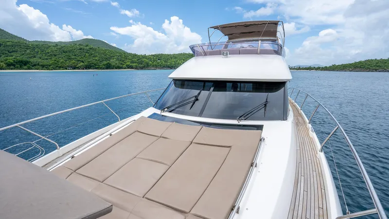  Yacht Photos Pics Luxury 2013 Prestige 620 yacht on serene water with scenic backdrop.