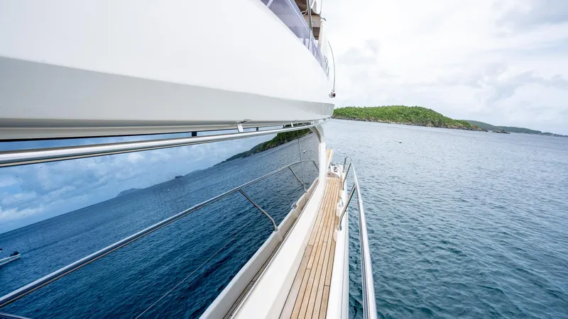  Yacht Photos Pics Side view of a 2013 Prestige 620 yacht cruising on calm waters.