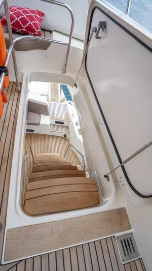  Yacht Photos Pics Staircase on 2013 Prestige 620 yacht with wooden steps and open hatch.