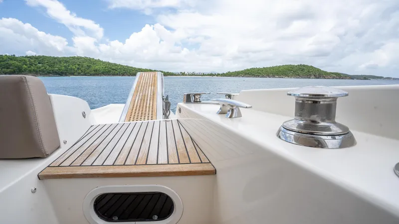  Yacht Photos Pics Prestige 620 yacht deck, 2013 model, with scenic ocean view and lush green islands.