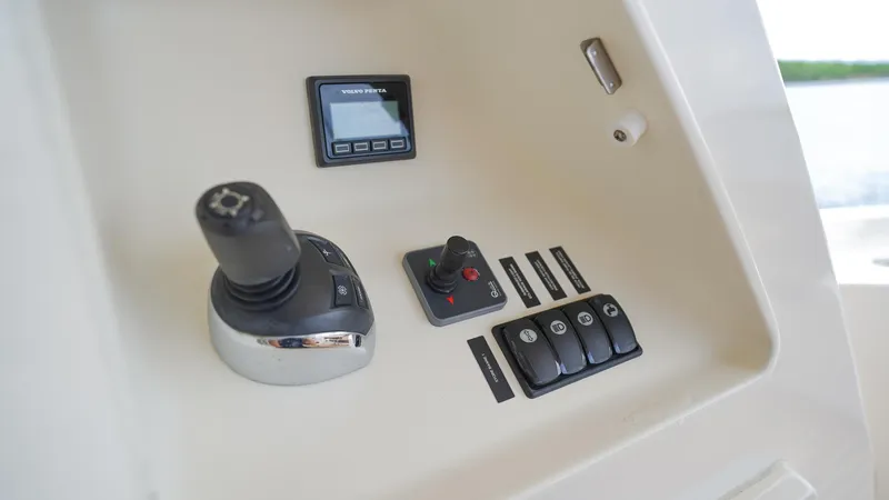  Yacht Photos Pics Control panel of a 2013 Prestige 620 yacht with joystick and digital display.
