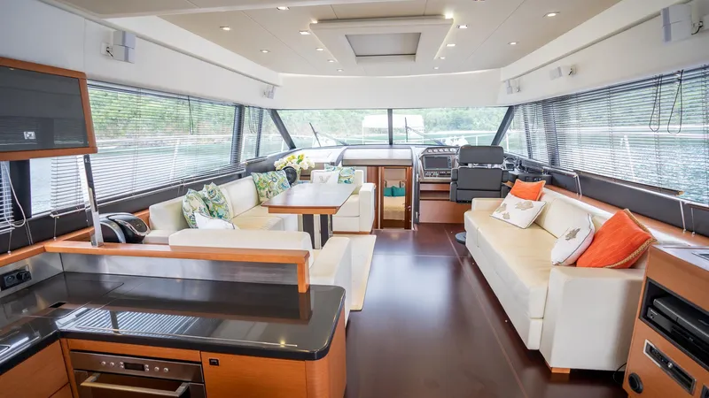  Yacht Photos Pics Luxurious interior of a 2013 Prestige 620 yacht with modern furnishings and panoramic windows.