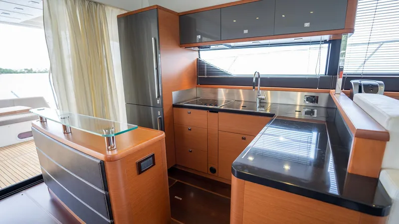  Yacht Photos Pics Luxurious kitchen interior of 2013 Prestige 620 yacht with modern appliances and sleek design.