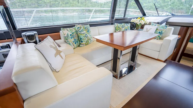  Yacht Photos Pics Luxurious interior of a 2013 Prestige 620 yacht with elegant seating and decorative cushions.