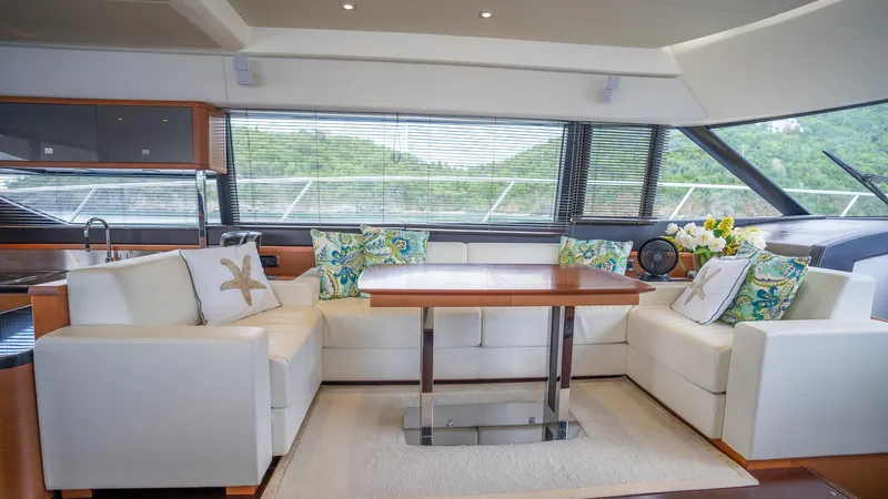  Yacht Photos Pics Luxurious interior of a 2013 Prestige 620 yacht with elegant seating and decor.