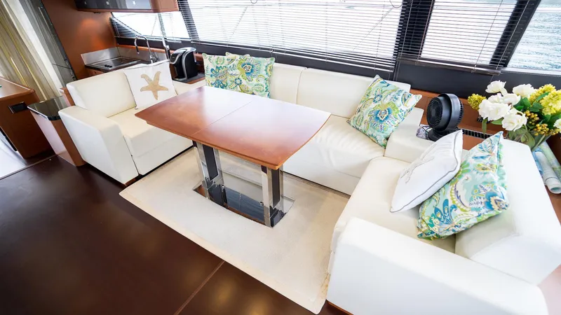  Yacht Photos Pics Luxurious interior of 2013 Prestige 620 yacht with elegant seating and decorative pillows.