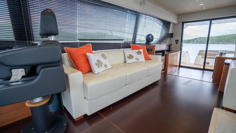  Yacht Photos Pics Luxurious interior of 2013 Prestige 620 yacht with white sofa and scenic view.