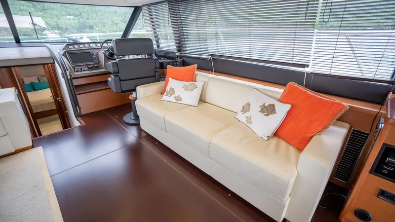  Yacht Photos Pics Luxurious interior of 2013 Prestige 620 yacht with leather sofa and helm station.