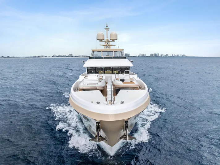 Northland Yacht Photos Pics 2017 Burger 104 Motor Yacht cruising on open sea, front view.