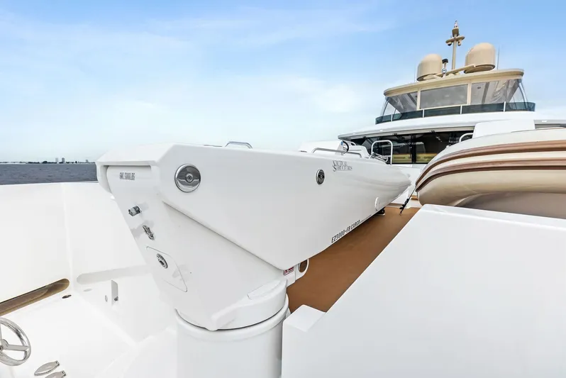 Northland Yacht Photos Pics 2017 Burger 104 Motor Yacht deck with crane and seating area.