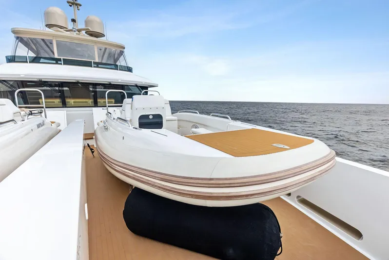 Northland Yacht Photos Pics 2017 Burger 104 Motor Yacht with tender on deck, ocean view.