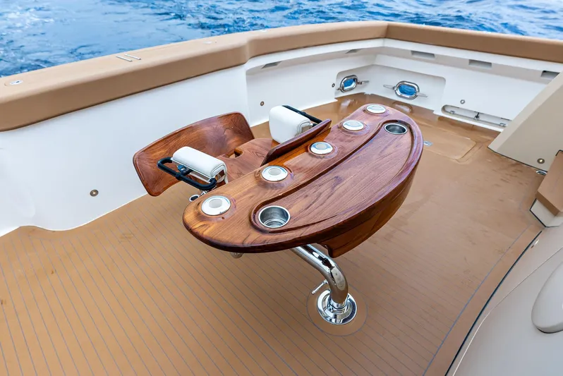 Northland Yacht Photos Pics Luxurious 2017 Burger 104 Motor Yacht deck with elegant wooden table and ocean view.