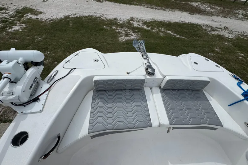  Yacht Photos Pics 2021 Twin Vee 280 CC GF boat with cushioned seating and Minn Kota trolling motor.