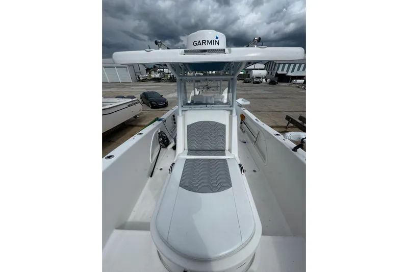  Yacht Photos Pics 2021 Twin Vee 280 CC GF boat with Garmin equipment, docked under cloudy skies.