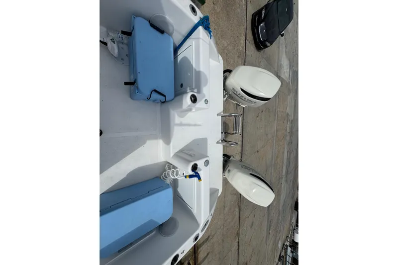  Yacht Photos Pics 2021 Twin Vee 280 CC GF boat with dual outboard engines and blue seating.
