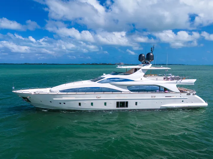  Yacht Photos Pics Luxurious 2012 Azimut Grande 105 yacht cruising on clear blue waters.