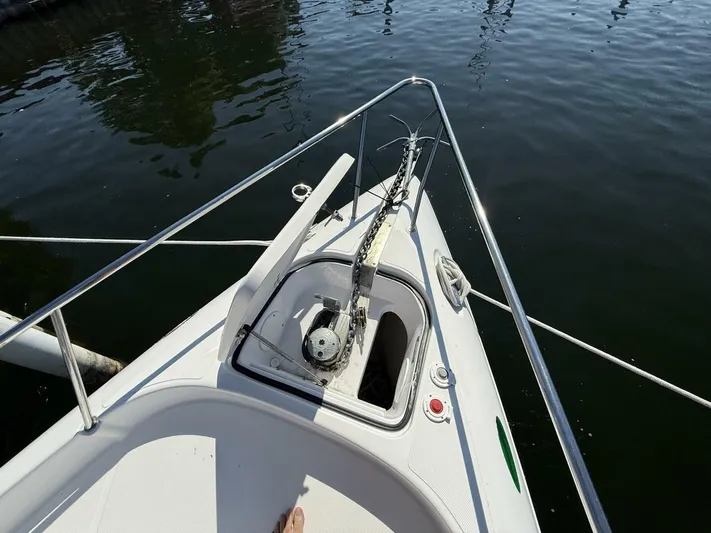  Yacht Photos Pics Bow of 2007 Donzi 38 ZSF boat with anchor and railing, on calm water.