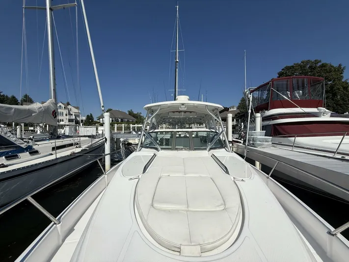  Yacht Photos Pics 2007 Donzi 38 ZSF boat docked at marina, surrounded by other vessels.