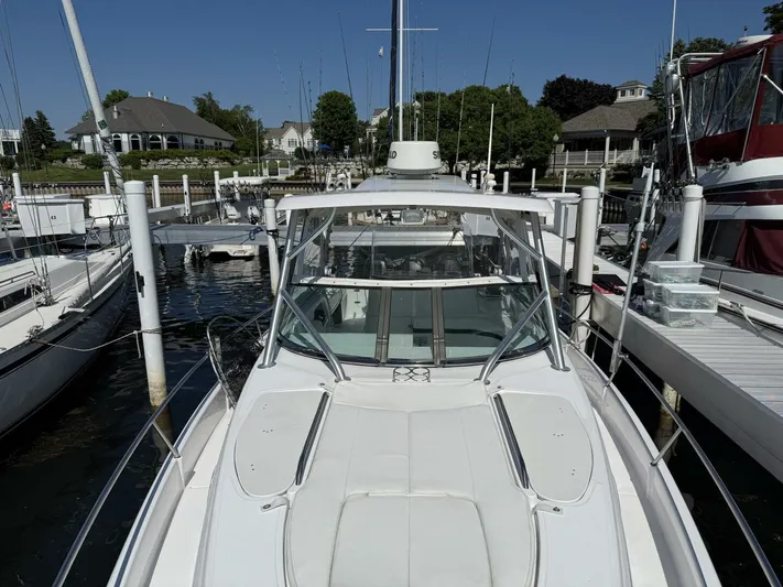  Yacht Photos Pics 2007 Donzi 38 ZSF boat docked at marina, surrounded by other vessels.