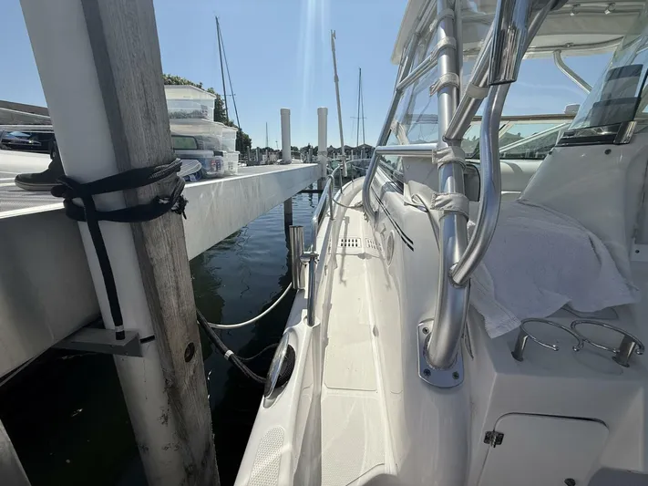  Yacht Photos Pics 2007 Donzi 38 ZSF boat docked, featuring sleek design and stainless steel railings.