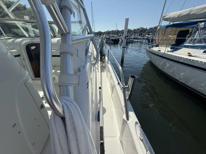  Yacht Photos Pics 2007 Donzi 38 ZSF boat docked at marina, featuring sleek design and stainless steel railings.
