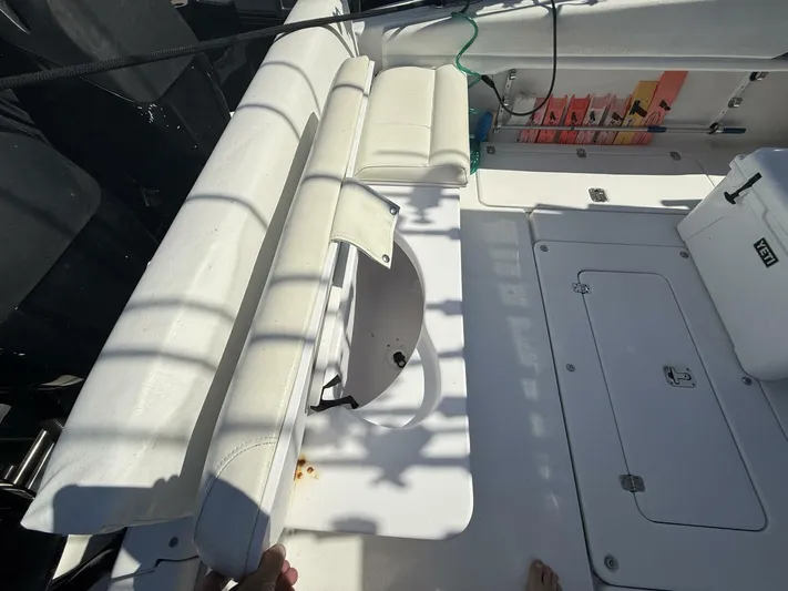  Yacht Photos Pics 2007 Donzi 38 ZSF boat interior with seating, storage compartments, and a Yeti cooler.