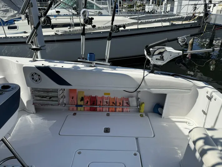  Yacht Photos Pics 2007 Donzi 38 ZSF boat interior with fishing gear and rod holders at a marina.
