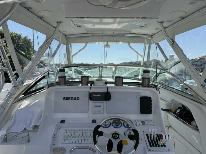  Yacht Photos Pics 2007 Donzi 38 ZSF boat cockpit with Simrad navigation system and steering wheel.