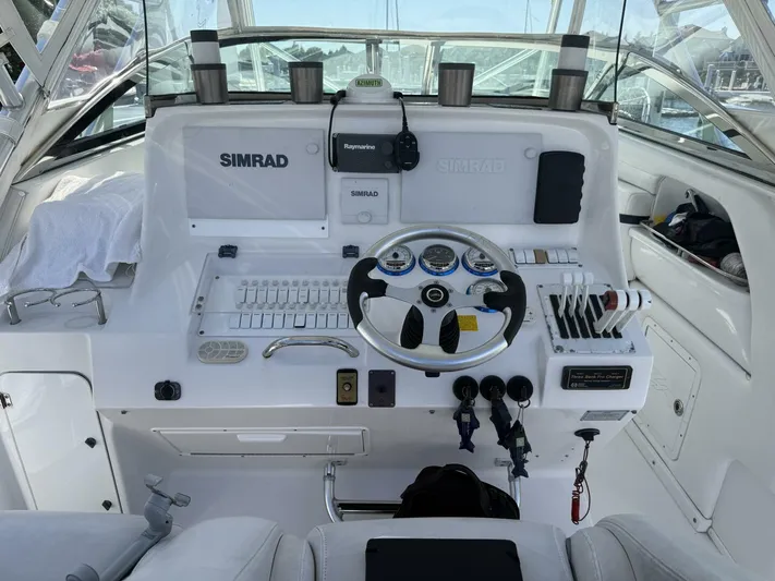  Yacht Photos Pics 2007 Donzi 38 ZSF boat cockpit with steering wheel, controls, and navigation equipment.