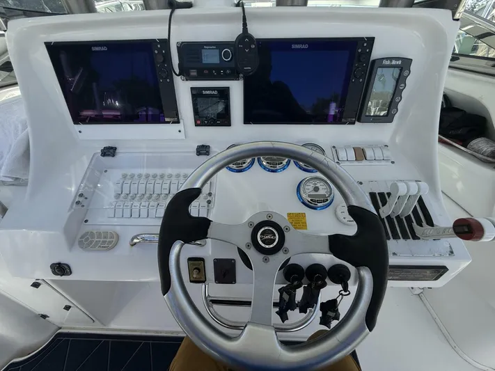  Yacht Photos Pics 2007 Donzi 38 ZSF boat dashboard with steering wheel and navigation controls.