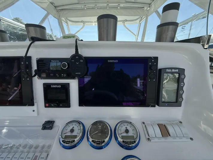  Yacht Photos Pics Control panel of a 2007 Donzi 38 ZSF boat with navigation and monitoring equipment.