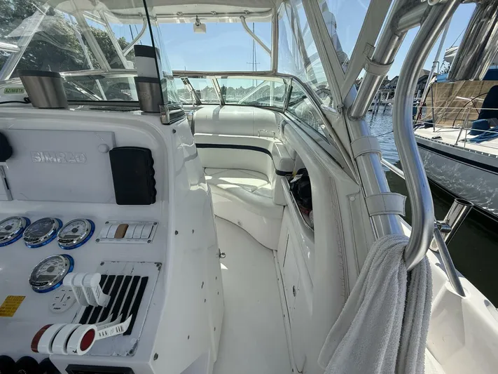  Yacht Photos Pics 2007 Donzi 38 ZSF boat interior with white seating and control panel, docked at marina.