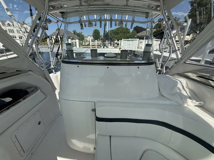  Yacht Photos Pics 2007 Donzi 38 ZSF boat interior with seating and helm, docked at marina.