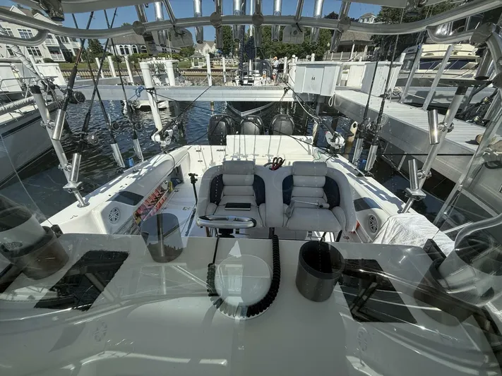  Yacht Photos Pics 2007 Donzi 38 ZSF boat interior with seating and fishing equipment at a marina.