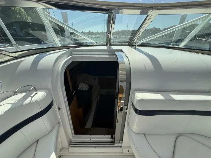  Yacht Photos Pics 2007 Donzi 38 ZSF boat interior with open cabin door, white seating, and glass windows.