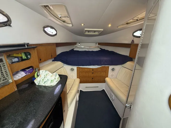  Yacht Photos Pics 2007 Donzi 38 ZSF cabin interior with bed, seating, and storage.